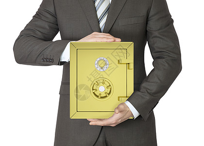 穿着西装的人拿着金子安全套装水平领带保护男人经济投资金融银行盒子图片