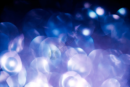 圣诞光灯摘要亮片水晶紫色背景金属微光宏观装饰品辉光钻石图片