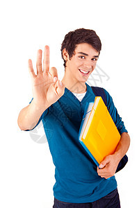 年轻快乐学生显示Ok标志青少年男性幸福背包职业教科书男人牛仔裤学校成人图片