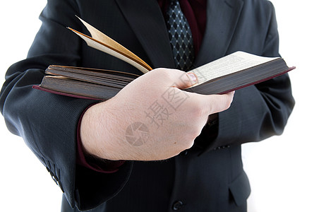 持有一本公开的天经的人商务词汇表阅读图书馆白色学生身体手指字典文学图片
