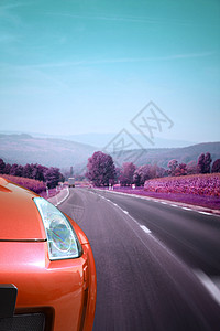 汽车在路上自由红色马力驾驶灯塔速度沥青大灯车辆赛车图片