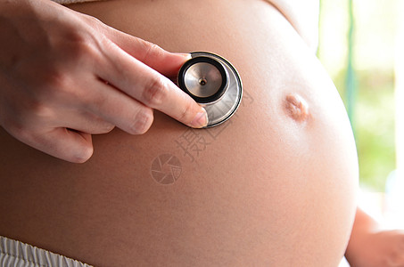 使用听诊器怀孕家庭女性新生活水平已婚护理腹部成就人类人手图片