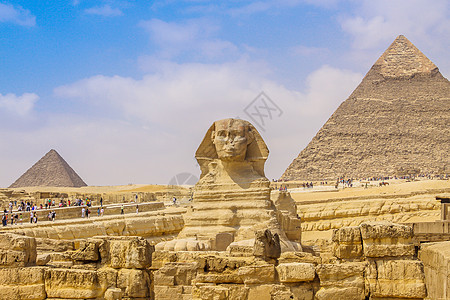 斯芬克斯和埃及伟大的金字塔上帝天空游客旅行建筑废墟人面地标沙漠假期图片