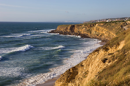 海滩沙滩旅游岩石热带悬崖场景蓝色天空波浪爬坡环境图片
