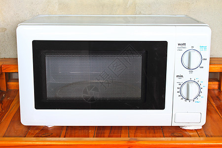 桌上的微波炉烤箱技术转盘用具黑色键盘材料厨具电子海浪图片