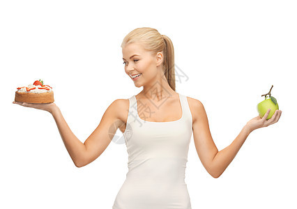 带苹果和蛋糕的运动妇女食物减肥化合物控制垃圾微笑糖果甜点女性碳水图片