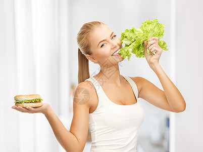 配有绿色生菜和汉堡包的妇女沙拉数字维生素青菜身体碳水生态化合物食物生物图片