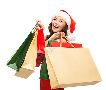 妇女穿着红色衣服 装着购物袋奢华快乐幸福零售季节消费者庆典女孩购物财富图片