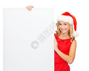 戴着空白白板的圣塔帮手帽的妇女女性折扣海报庆典微笑销售女孩帽子广告木板图片