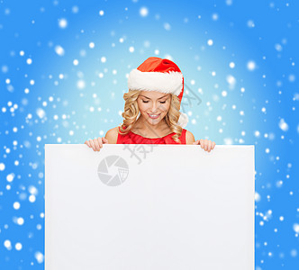 戴着空白白板的圣塔帮手帽的妇女雪花女孩帮手季节裙子销售木板微笑海报帽子图片
