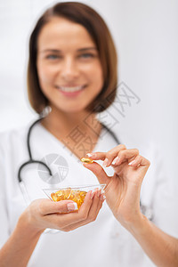 持有一碗胶囊的医生药品医院维生素治愈药店医疗保险药物化学治疗药剂学图片