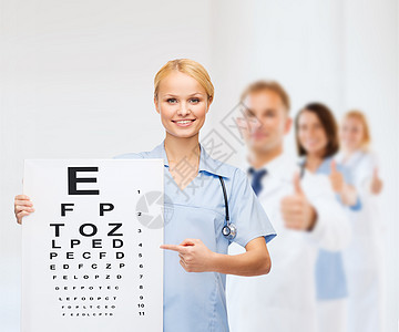 带眼图 微笑的女医生或护士卫生药品成人图表专家医院眼睛帮助职业字母图片