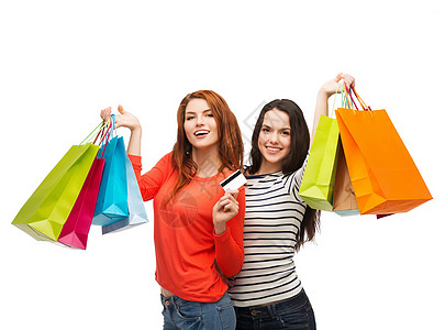 拥有购物袋和信用卡的少女女孩人数礼物塑料季节购物者零售购物狂折扣幸福提倡者顾客图片