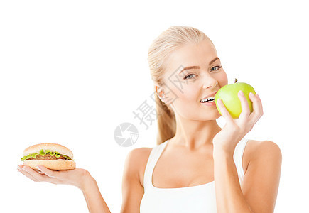 带着苹果和汉堡包的笑着女人图片