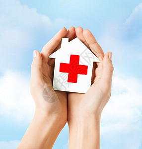 手持红色十字红十字纸房帮助志愿者药店诊所设施治愈疾病临床卫生机构图片