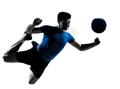 男性足球运动员的脚影阴影跳跃球员标题背光男人背景图片