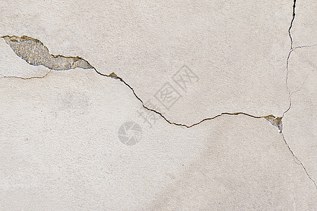 裂开的 stucco宏观蟑螂狂热缺陷侵蚀材料石膏裂痕眼泪古铜色背景图片