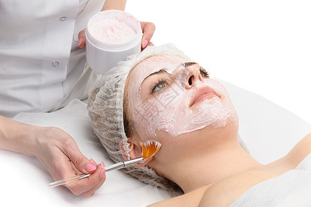 应用的面部剥皮面罩刷子女孩面具女性休息化妆品治疗温泉美容沙龙图片