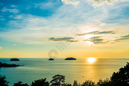 日落时沙滩假期海浪阳光海滩冲浪橙子海岸海岸线旅行太阳图片