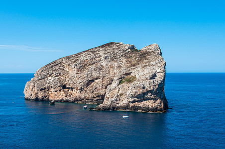 撒丁岛海岸景观海景海岸线日落海浪地平线门廊支撑假期风景晴天图片