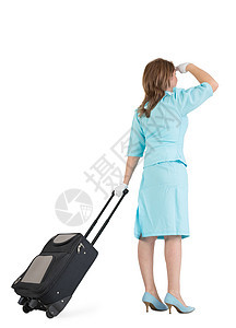 穿着蓝色制服的女职员和她的包全体人员手套棕色头发航班高跟鞋职业牵引衣服图片