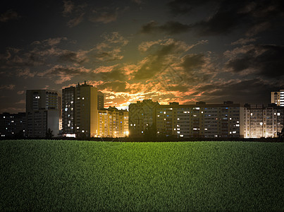 建筑物和绿草地市中心景观绿色城市日落摩天大楼天空建筑学场地土地图片