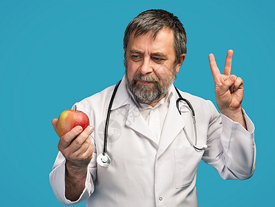 医生为健康饮食提供苹果工人食物诊所养分考试护士药品水果职业锻炼图片