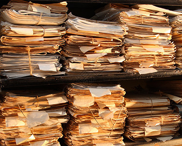 归档中的纸张文档文件夹办公室组织贮存命令档案记录文书工作图书馆图片