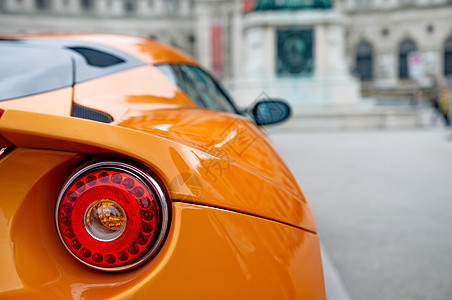 橙色运动车后面运动车辆驾驶奢华速度红色旅行运输橙子力量图片