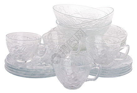 厨房的玻璃器械在背景上打响菜肴器皿杯子房子垫圈洗碗机盘子白色塑料餐具图片