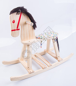 白色背景的搖滾馬乐趣娃娃儿童童年婴儿手工孩子小马座位玩具图片