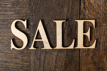木木背景的木木字母字体艺术公司古董粮食销售拉丁打印棕色凸版图片