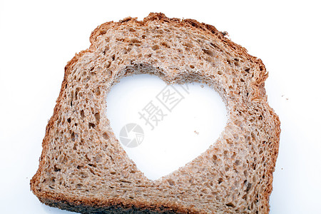 面包片中的心形洞生活饮食宏观食物厨房小麦棕色白色营养活力图片