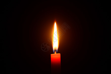 红蜡烛在黑色背景下燃烧烧伤橙子场景假期温泉宏观红色火焰宗教纪念馆图片