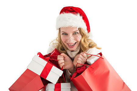 女孩在冬天时装 拿着礼物和购物袋图片