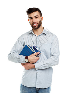 长着大胡子微笑的年轻男子 手拿着书在白色上快乐幸福男人男性知识教科书家庭作业学生大学学校图片