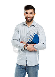 长着大胡子微笑的年轻男子 手拿着书在白色上大学男性阅读快乐知识家庭作业男人学校教育幸福图片