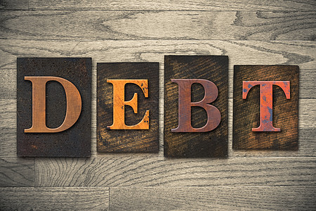 债务概念木制印刷品类型打字稿木头凸版字母退休预算贷款债务人破产粮食图片