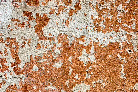 含白洗和橙色油漆残余物的混凝土表面裂缝材料砂浆建造风化粉饰石灰水石灰橙子水泥图片