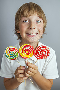 男孩吃棒棒棒糖幼儿园舌头孩子糖果甜点快乐漩涡幸福食物小吃图片