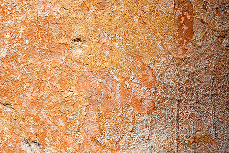 含橙色油漆和洗白液残余物的混凝土表面建造橙子建筑粉饰材料石灰水砂浆石墙美白风化图片