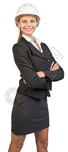 身戴硬帽子的女商务人士 她的双臂交叉胸怀职业员工女士长度工程师微笑安全工作工业女性图片