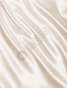 优雅的金丝绸作为婚礼背景 在塞皮亚新娘涟漪织物版税棕褐色奶油布料丝绸投标折痕图片