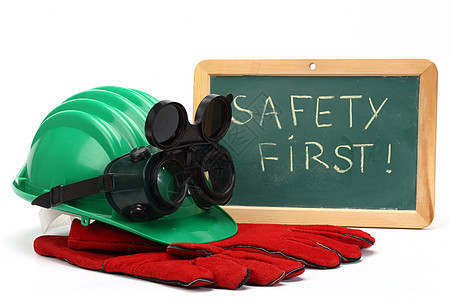 安全第一安全首先概念头盔商业白色木板手套危险注意力帽子工作风镜图片