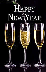 新年快乐的复合形象庆典长笛问候语反射微光高脚杯气泡图片