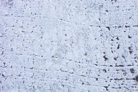 充满丰富和各种纹理的白墙裂缝石灰水风化石灰材料石墙建造石膏水泥粉饰图片