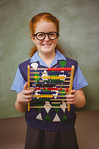 带着算盘的可爱小女孩的肖像学习数字早教知识童年小学生小学教育数学女性图片