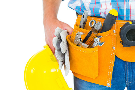 手工工人在戴手套和头盔时身着工具带技术员安全帽男性修理工工作服体力劳动黄色服务扳手手工具图片