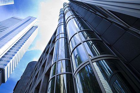 蓝天背景的办公楼建房组织市中心城市建造反射蓝色技术玻璃窗户摩天大楼图片