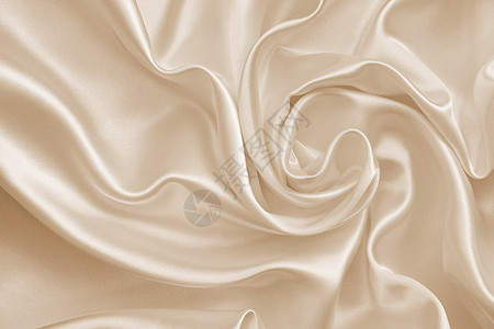 平滑优雅的金丝绸或作为婚礼背景的席子投标海浪涟漪调子窗帘奶油棕褐色版税折痕折叠图片